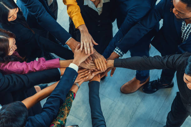 istock Diversity people putting their hands together. Showing unity. Intellectual. 2154574150