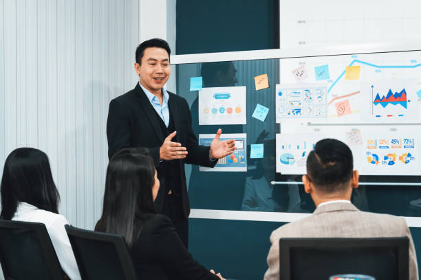 istock Confident manager presenting project in front of glass whiteboard. Intellectual. 2154575460
