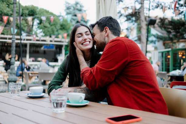 Couple sharing an affectionate moment at cafe