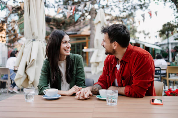 istock Couple enjoying coffee and conversation outdoors 2154575847