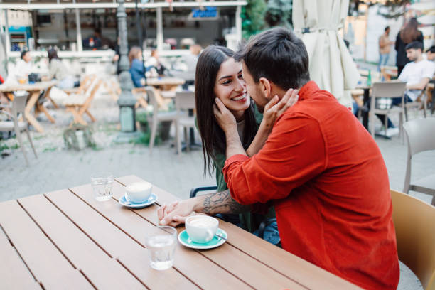 istock Couple engaging in tender conversation at cafe 2154576111