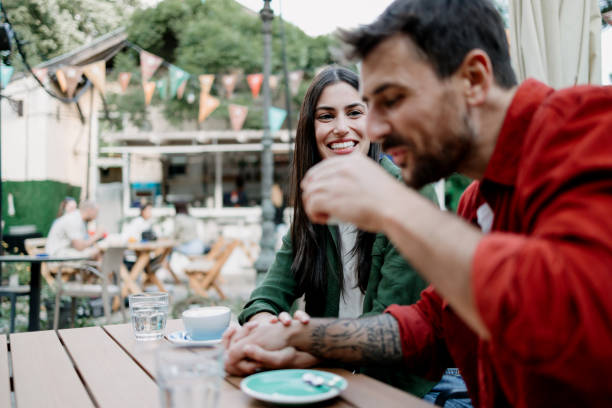 istock Playful couple interacting at a coffee shop 2154576148