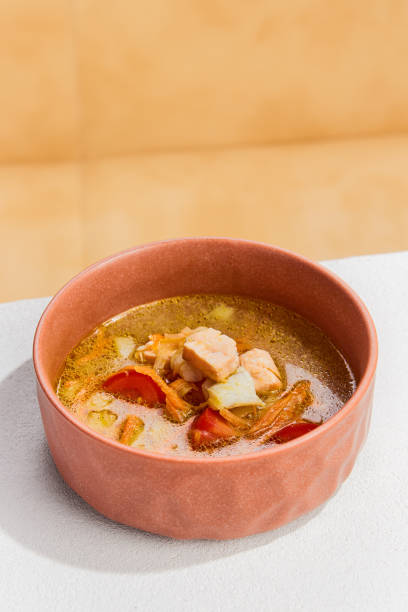 istock Delicious Fish Soup with Two Varieties of Fresh Fish in a Rustic Bowl 2154576601