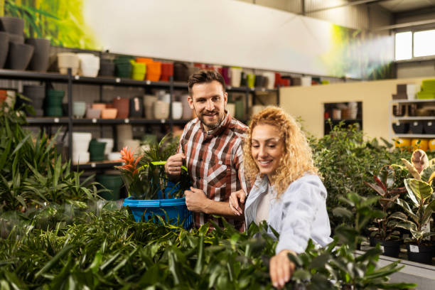 istock Couple Enjoying Plant Shopping 2154580229