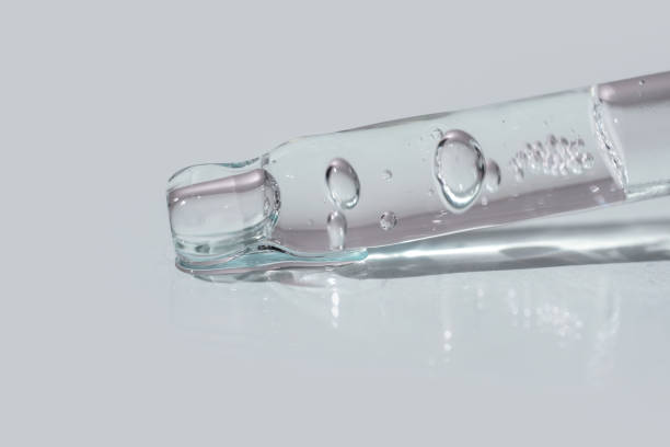 istock A glass pipette containing a cosmetic product. 2154580586