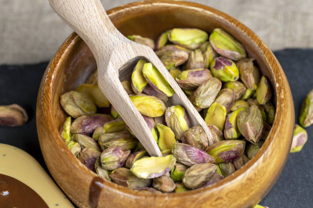 istock delicious salted green pistachios without shells 2154581958