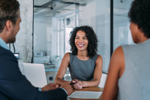istock Group of business persons talking in the office. 2154584837