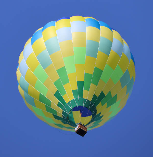 hot air balloon floating in a blue sky