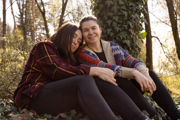 istock two young women in nature, in the forest 2154591670
