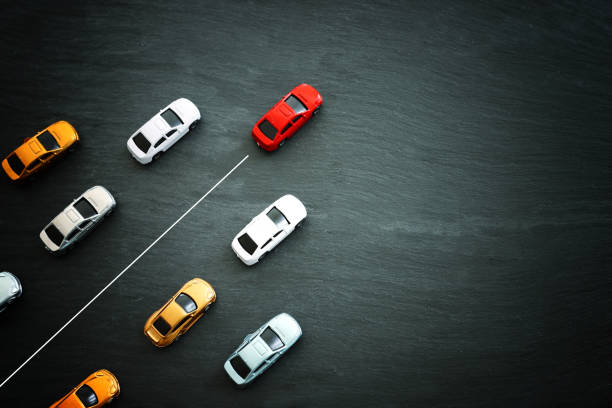 istock Concept image of challenge and teamwork. Red car leading the group 2154593497