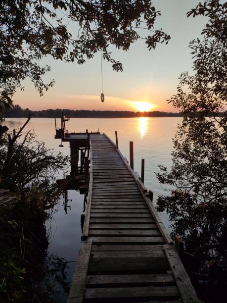 istock A serene lakeside sunset with pier, calm and tranquility 2154603658