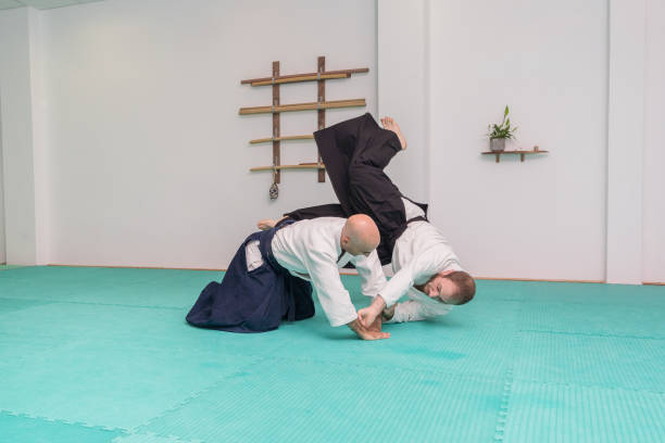 istock Two men fighting in kimono at the gym 2154605470