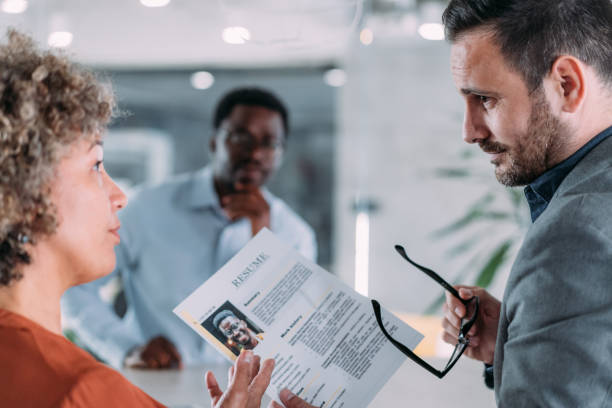 istock Confident male applicant talking at job interview answering questions. 2154608722