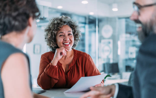 istock Group of business persons talking in the office. 2154608748