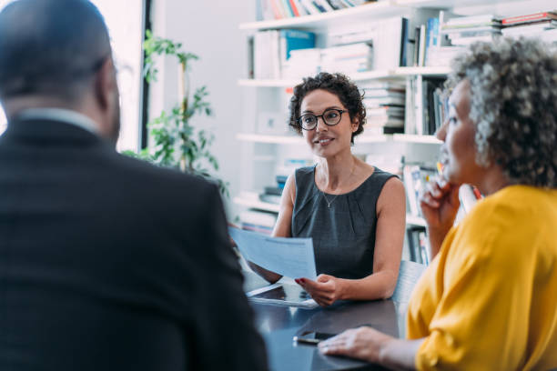 istock Group of business persons talking in the office. 2154608770