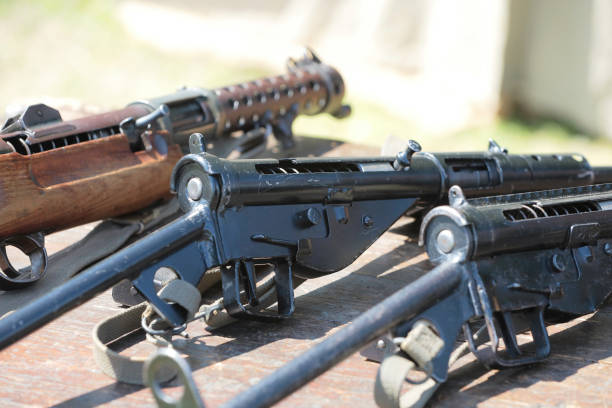 The Sten Gun was Britain's answer to the need of a sub machine gun. iit cost $11 USD (in 1942), whereas the Thompson from the US cost over $70 USD. Cheap and easy to manufacture, these were produced in their thousands to supply the British Army, and resistance fighters in europe.This image was taken at an outdoor event in July 2023, where reenactors, living historians, and members of the public can come to experience what life was like during the second world war, with live demonstrations, battle reenactments, and static displays from all over the world.