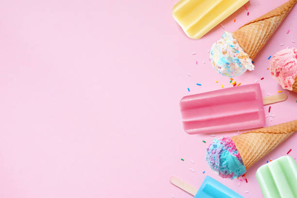 istock Colorful pastel summer ice cream cone and popsicle side border on a pink background 2154618104