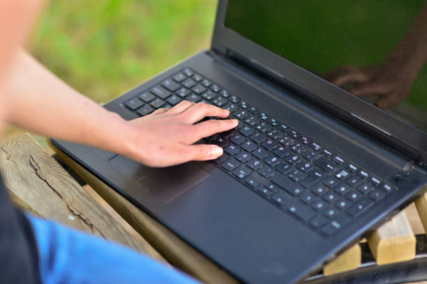 Close-up photos of businesswoman running her business from computer and tablet in open area