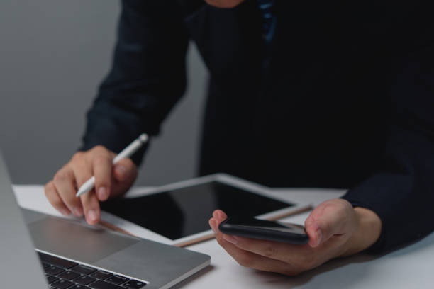 istock Businessmen working with modern technology are using smartphones to search for information online on the internet. 2154622336