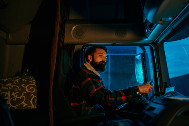 istock A truck driver is driving a long distance load 2154626870