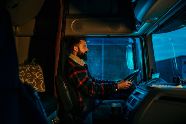 istock A truck driver is driving a long distance load 2154626874
