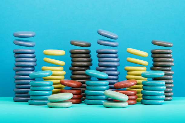Stacked and colored coins, finance background. Digitally generated image. 3d render.