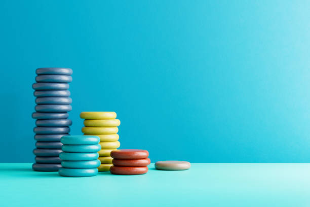 Stacked and colored coins, finance background. Digitally generated image. 3d render.