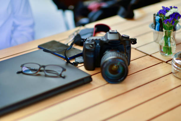 close-up shot of beautiful reflection in photographer equipment camera and lens