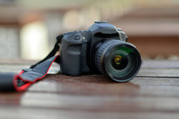 Big Black DSLR Digital Camera full frame sensor with lens on white background.