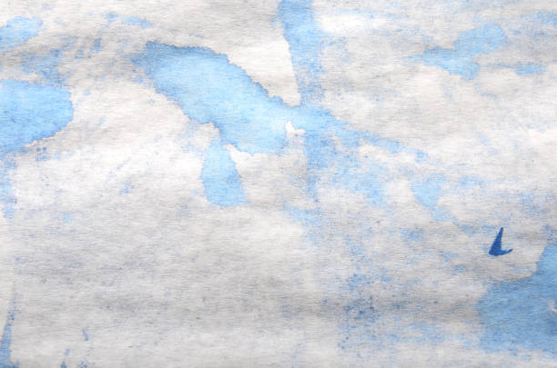 simple background of blue paint stains on white paper