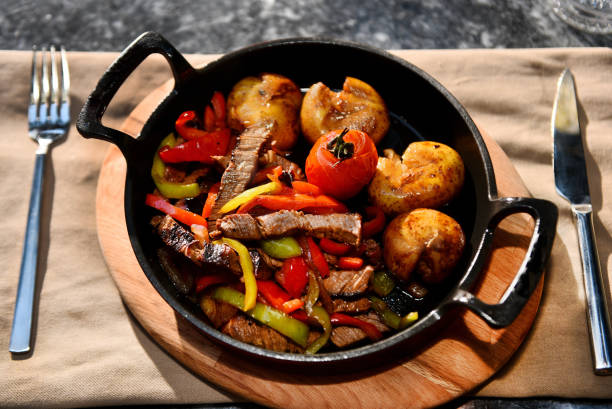 Hot bowl with potatoes vegetables and meat