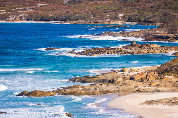 Bright blue ocean with rocky coastline. Photographed in Western Australia.