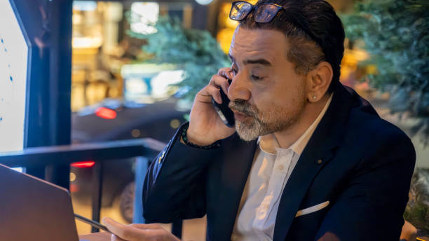 istock Mature handsome businessman working with his laptop outside office environment 2154631728