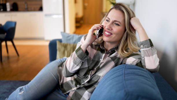 istock Woman chatting on mobile phone 2154633181