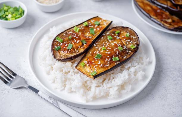 istock Teriyaki sauce eggplant slices with rice in a plate 2154633549
