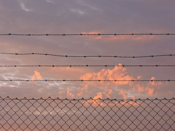 istock Sky behind the wire fence 2154641957