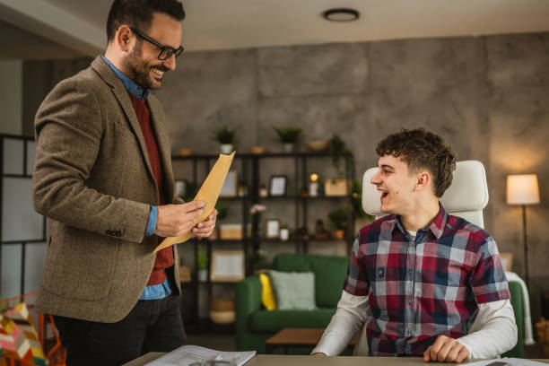 istock Professor bring envelope with scholarship young student to open home 2154642632
