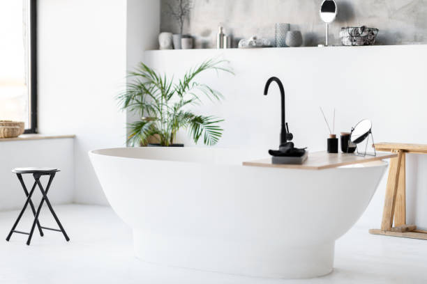istock Chic, minimalist bathroom with modern striking freestanding tub, interior shot 2154649467