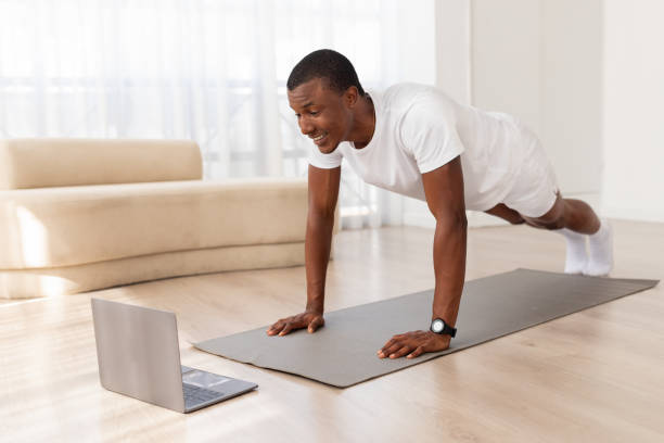 istock Man in a push-up position in a clean room 2154649938