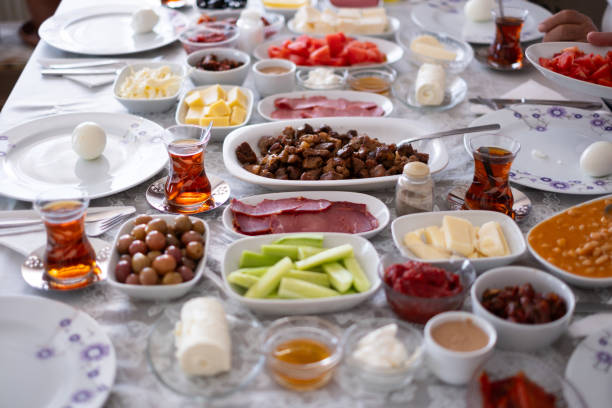 istock Traditional Turkish breakfast image. There are cheese varieties, jam varieties, olive varieties, tomatoes, pastries, dried meats, and fruits. stock photo 2154652221