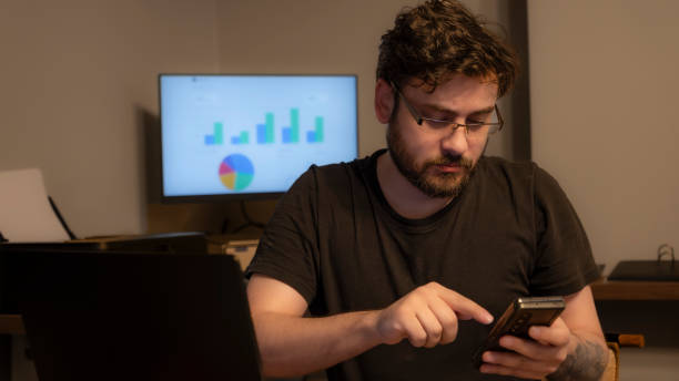 istock Middle-aged messy businessman working with his laptop in office environment 2154653350