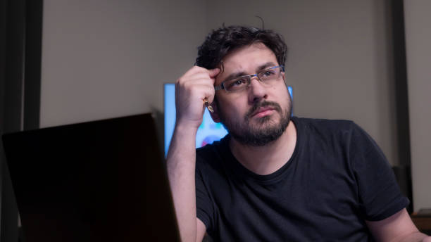 istock Middle-aged messy businessman working with his laptop in office environment 2154653413