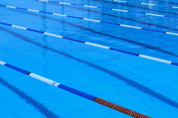 istock empty Olympic swimming pool , blue water , rope pool dividers design element 2154657320
