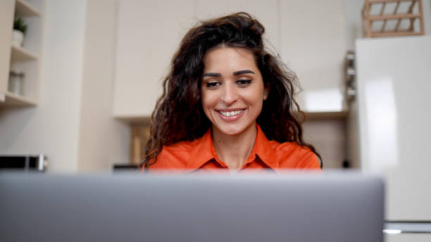 istock Beautiful woman working on her laptop 2154657764