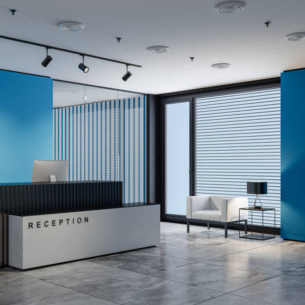 istock Modern blue and white office interior reception area with big black and white desk 2154658454