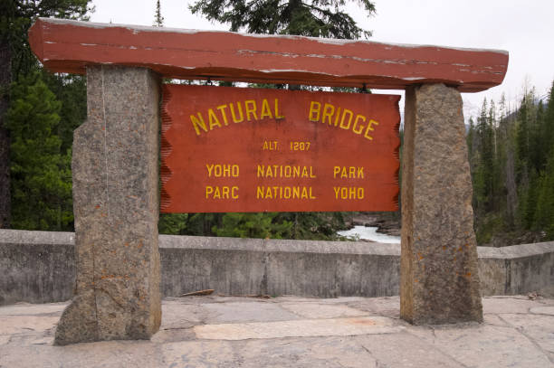 istock Natural Bridge Yoho National Park sign on cloudy day 2154660925