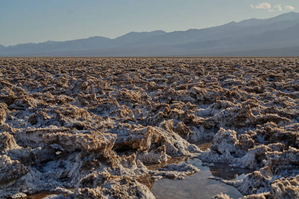 Death Valley is the hottest and driest place in North America due to its lack of surface water and low relief. Thanks to the rainfall the valley received this year, you can see a shallow lake formed in Badwater Basin. This is an extremely rare event. People can even kayak in Death Valley although only temporarily.