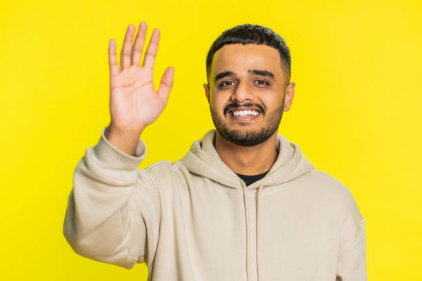 istock Happy man smiling friendly waving hands gesturing hello greeting or goodbye, meeting invitation 2154664105