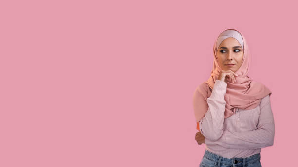 istock Curious woman advertising background considering 2154664290