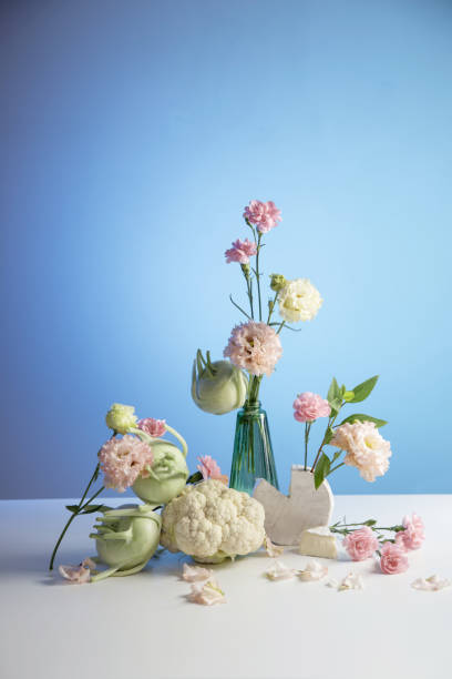 istock unusual composition of flowers, vegetables and cheese 2154664682
